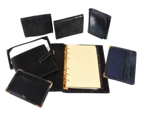  Asprey, a gentleman's four piece accessory set,   to include: a black leather address book, 17.4 x 11.5cm, a black leather w