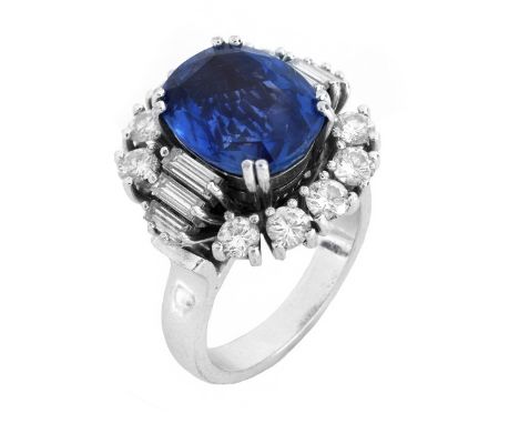Vintage Approx. 4.0 Carat Oval Cut Sapphire, 1.0 Carat Round Brilliant and Baguette Cut Diamond and 18 Karat White Gold Ring.