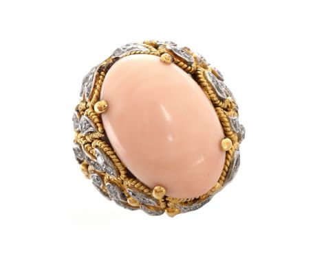 Vintage Oval Cabochon Angelskin Coral, Diamond and 18 Karat Yellow Gold Ring. Coral measures 21mm x 14mm. Stamped 18K. Ring s