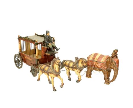 Vintage Hand Painted Wood and Composition Circus Carriage. Includes: wagon, two horses, and an elephant. Carriage measures 20