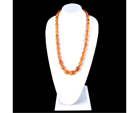Vintage Amber Bead Necklace. Unsigned. Graduated oval beads measure 30mm to 24mm. Condition: Good condition. Estimate: $200.0