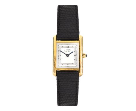 Must de Cartier Tank Watch. Quartz movement with cabochon sapphire crown . Roman numeral dial with blued steel hands. Cartier