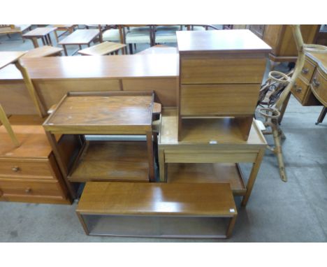 Two teak trolleys, a teak bedside chest and a teak shelf 