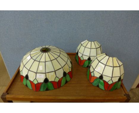 A set of three Tiffany style light shades 