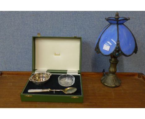 A salt pot and spoon and a small Tiffany style table lamp 