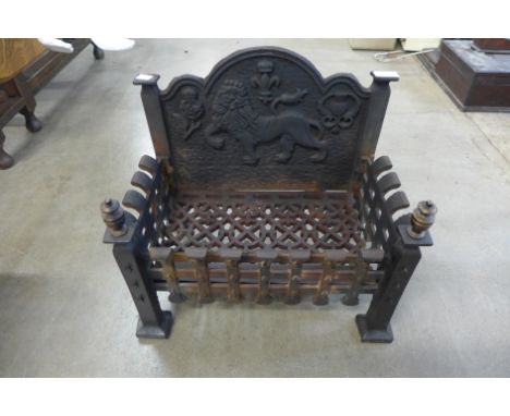 A Victorian cast iron fire grate 