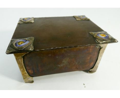 An Arts and Crafts copper and white metal mounted enamelled trinket box, the hinge lid opening to reveal silk lined interior 