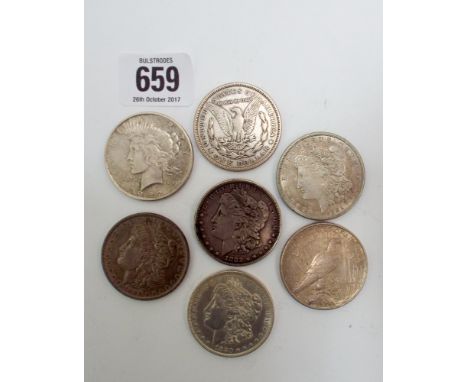 Collection of seven silver USA dollars, dates range from 1880 through to 1922