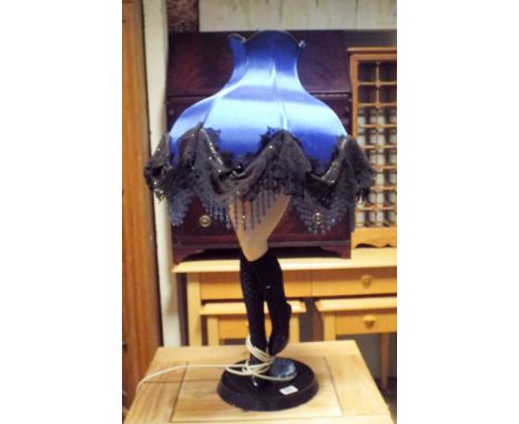 Pair of legs table lamp with blue fringed shade 