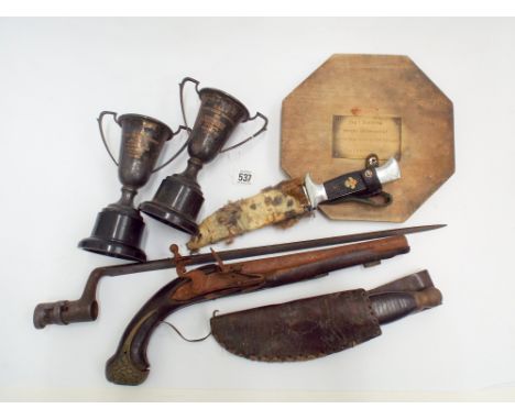 A few items of sporting memorabilia to include knives, bayonet, and an old flint lock gun 