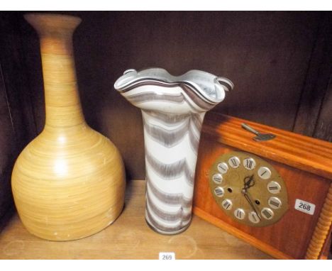 Striking mantle clock, large pottery vase and a coloured glass vase 