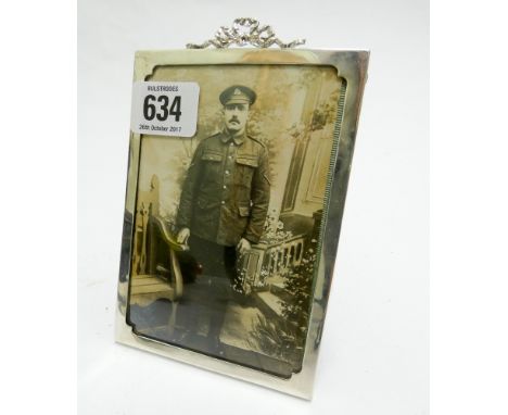 Smaller rectangular easel photograph frame with ribbon bow cresting, height 15cm 