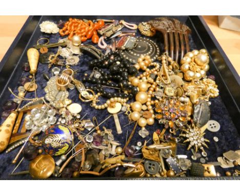 A large selection of Victorian and later costume jewellery to include a tortoiseshell hair comb, beads and bits