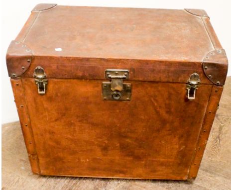 A late Victorian leather trunk with fitted tray interior 23" wide, 13" deep, 21" high   There is one small rip to the side of