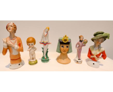 A group of six Art Deco bisque and porcelain pin cushion half dolls to include Cleopatra and Bell Hop examples   One doll has