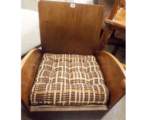 Low Arts and Crafts style oak framed elbow chair with cushion 