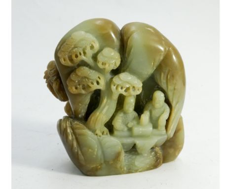 A jade scholars rock carved with figures in a landscape height 12cms 