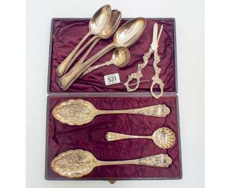 Box set of highly decorated berry spoons and sugar sifter, together with some odd dessert spoons, small ladle and grape sciss