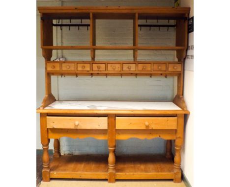 A pine double sided kitchen dresser/worktable with marble top with shelf and spice drawer back, drawers under with pan rack b