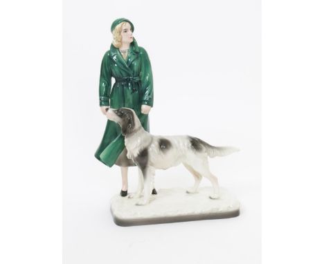  A Goldscheider Pottery model of a woman with attentive setter dog, designed by Stephan Dakon, model no. 6756, painted in col