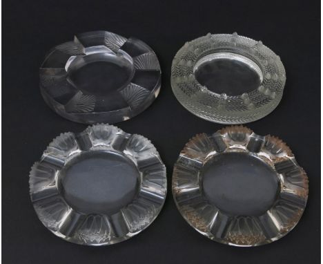  'Martinique' no.298 two Lalique clear and frosted glass cendrier designed by Rene Lalique, one with sepia staining, a 'Cuba'