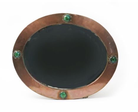  An Arts and Crafts patinated copper wall mirror probably retailed by Liberty & Co, oval section set with four Ruskin ceramic