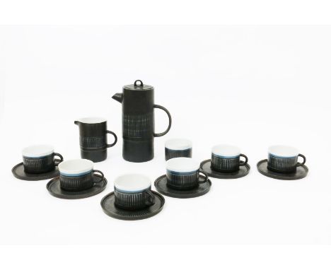  A Troika Pottery coffee set for six, designed by Benny Sirota, cylindrical form, sgraffito decorated with a band of blue lin
