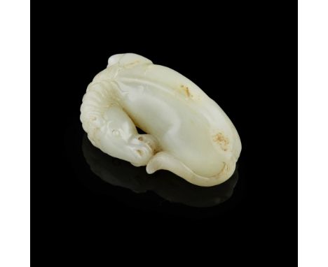 CELADON JADE CARVING OF A RECUMBENT HORSE  the horse carved in a recumbent position with head turned backward playfully touch