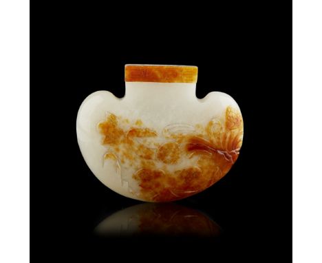 WHITE AND RUSSET JADE SNUFF BOTTLE  of flattened ruyi form, one side carved in low relief with a pair of chicks beneath a spr