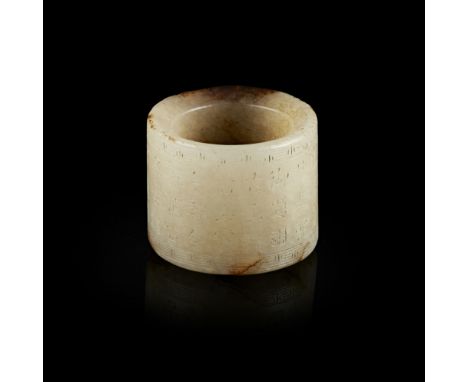INSCRIBED GREY AND BROWN JADE ARCHER'S RING, BAN ZHI  incised between leiwen bands with a poem written by Emperor Qianlong, w