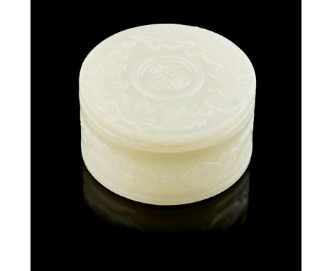 FINE WHITE JADE CIRCULAR BOX AND COVER  QING DYNASTY, 17TH/18TH CENTURY   the exterior of the box carved in archaistic style 