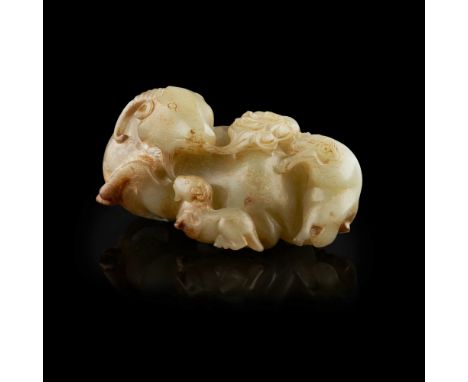 CELADON JADE 'RAM' GROUP  carved as a large recumbent ram playing with its young crouching behind, its bearded jaw issuing st