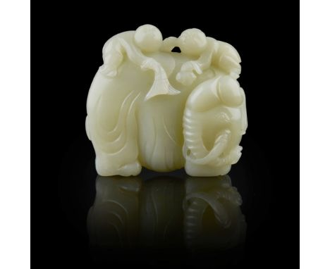 CELADON JADE CARVING OF TWO BOYS WASHING AN ELEPHANT  finely carved in the round as an elephant standing four-square with its