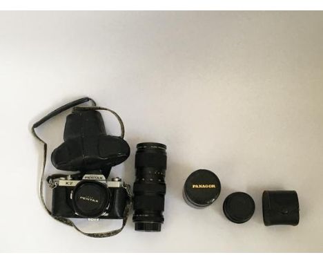 A Pentax K2 camera, together with additional lenses.