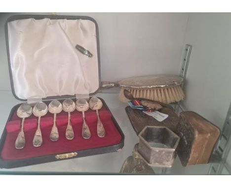 A collection of silver items to include spoons cigarette case brush etc.