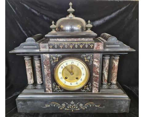 A black slate and marble architectural style mantle clock.approx 40cm.