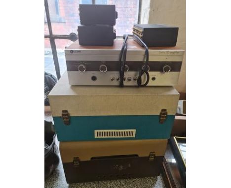 Two portable record players, Leak Delta 30 amplifier, and three Qed tape switching units.