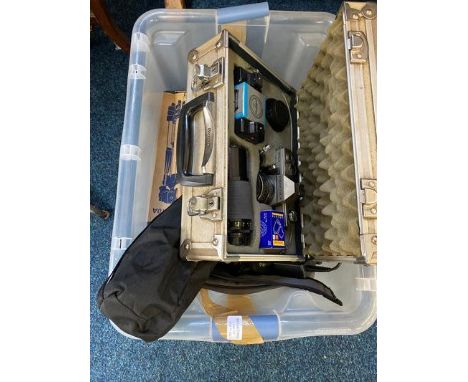 A box containing a quantity of camera equipment, to include a Praktica camera.