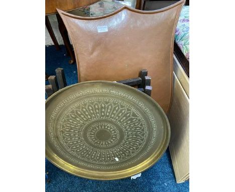 A copper fire screen, copper bowl and brass topped table.