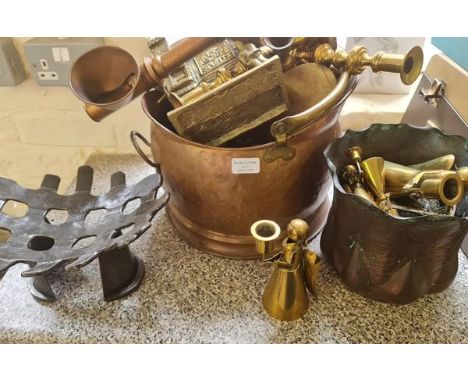 A collection of brass and copper to include candlestick cole bucket and lamp.