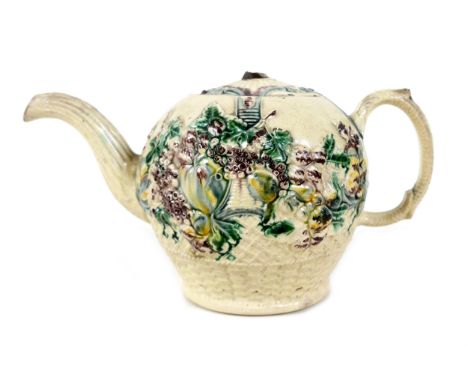 A Staffordshire creamware teapot, circa 1765, probably by William Greatbatch, of ovoid form decorated in moulded relief 'frui
