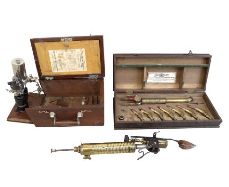A steam engine indicator, and welding blow pipe set. (3) 