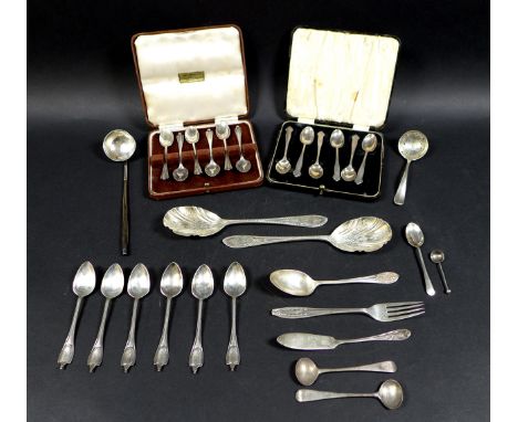 A collection of silver flatware, comprising two boxed sets of teaspoons, a pair of fruit spoons, eleven spoons, a knife, fork