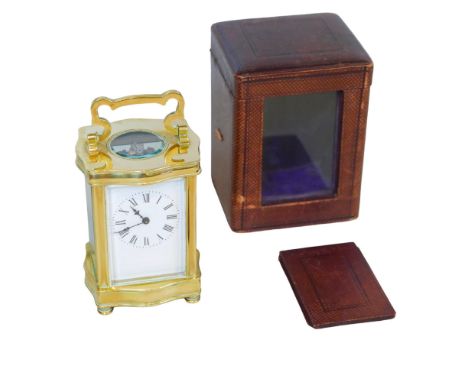 A 20th century French brass carriage clock, with Roman numeral dial, 8.5 by 7.5 by 13cm high, together with its travel case. 