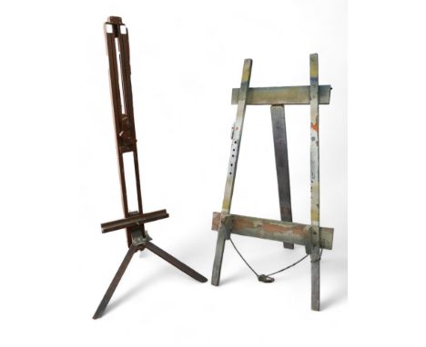Two artists easels, comprising a vintage adjustable easel on tripod legs, 181cm high, together with an A frame easel/display 