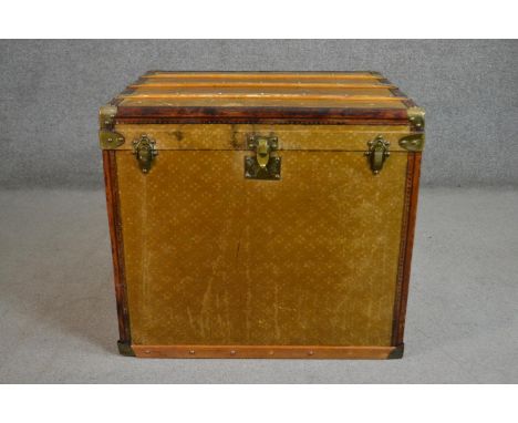 A late 19th/early 20th century steamer trunk, similar to those made by Louis Vuitton, with a printed finish, the lid wood bou