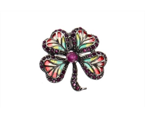 PLIQUE-A-JOUR FOUR LEAF CLOVER BROOCH, set with a central ruby 5mm diameter flanked by four enamelled sections bordered by ro