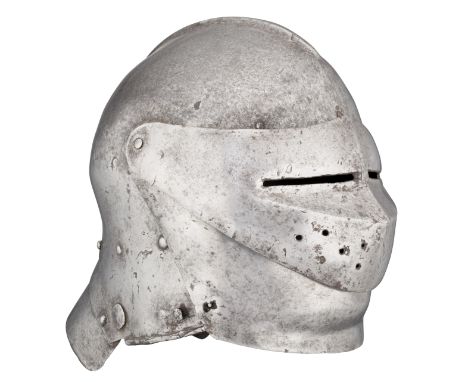 ‡ A COMPOSITE GERMAN CLOSE HELMET, EARLY 16TH CENTURY with rounded one-piece skull formed with a low slender medial comb (pie