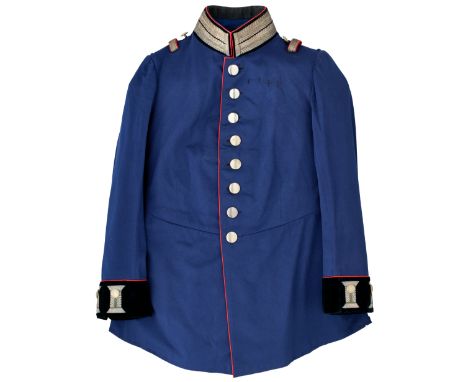 AN OFFICER’S BLUE FULL DRESS TUNIC OF THE GERMAN STAFF OR PIONEERS with black velvet facings, scarlet piping, and silver litz