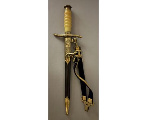 AN EAST GERMAN NAVAL DAGGER, MID-20TH CENTURY of regulation type, the forte stamped 29849, in its scabbard with gilt mounts a